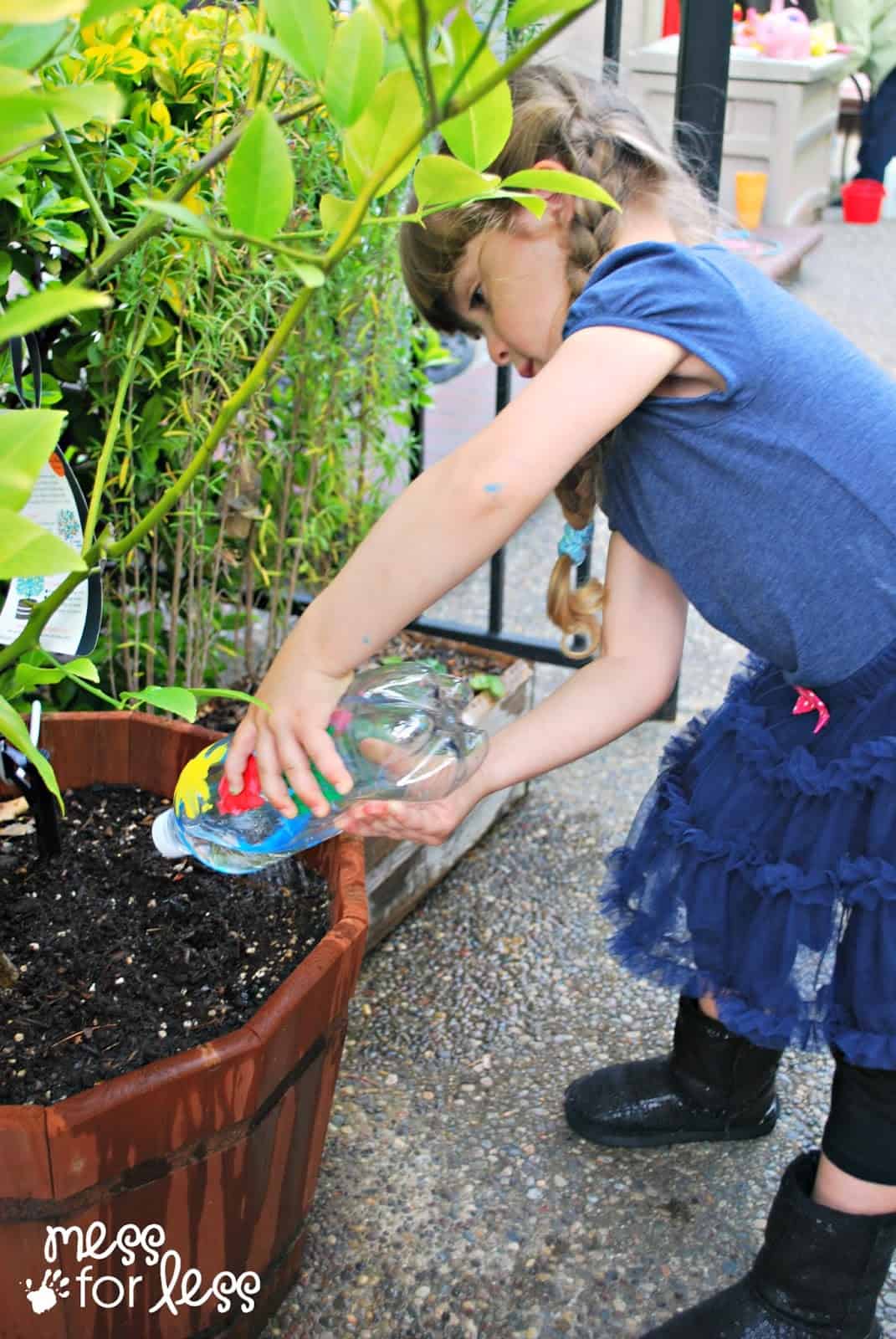 child watering plants