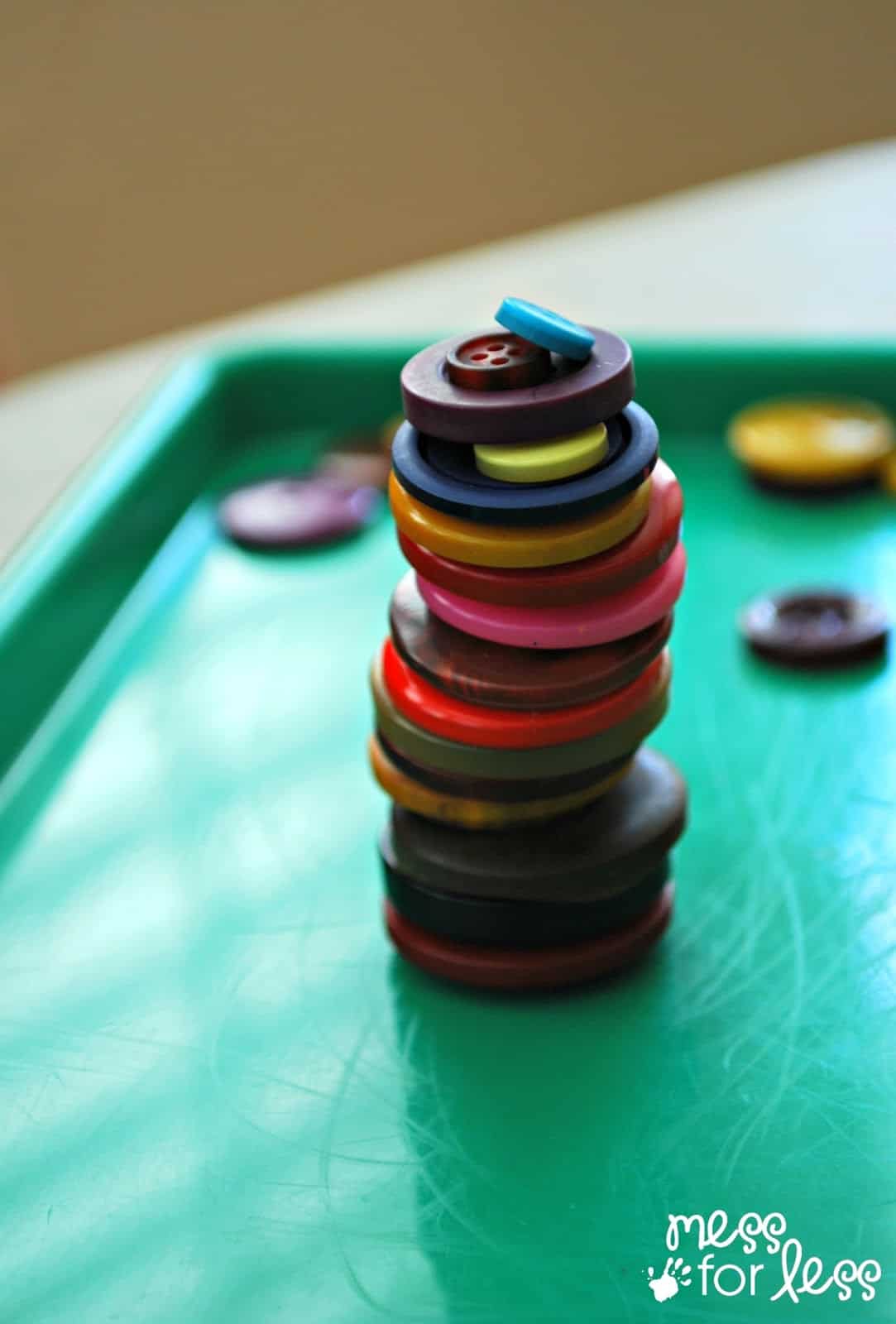 Button Stacking Game - Find out how simple this game is to play and what you need to play it anywhere. My kids loved it!
