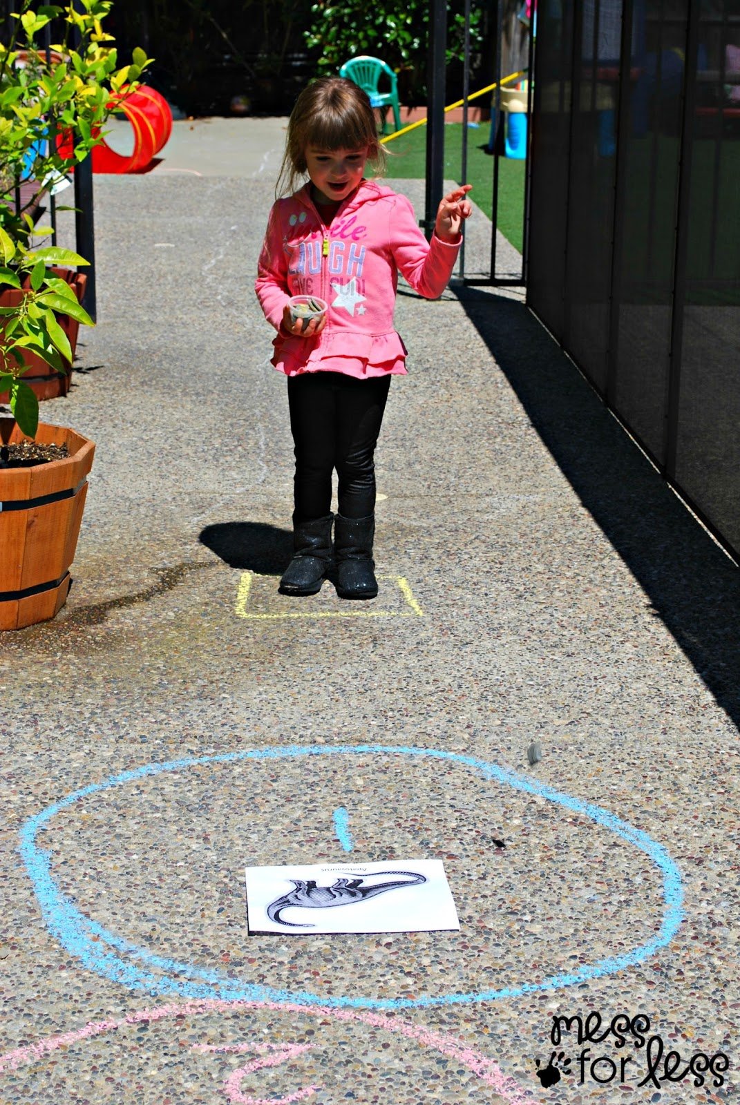 child throwing rocks