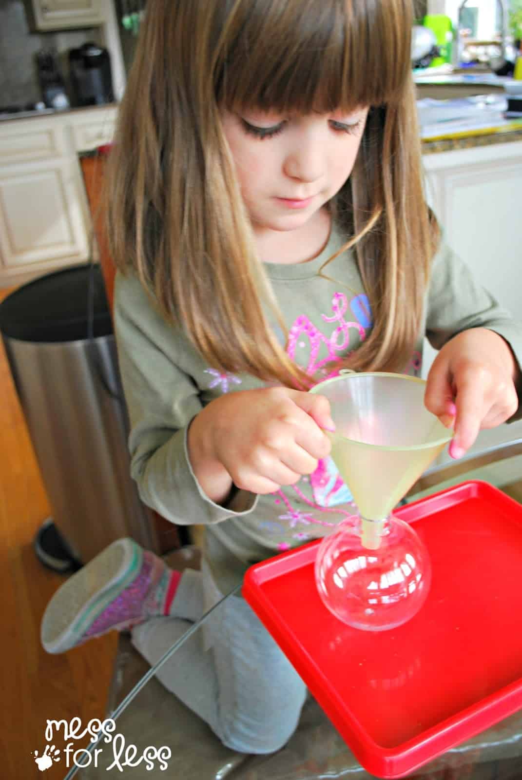 child using a funnel