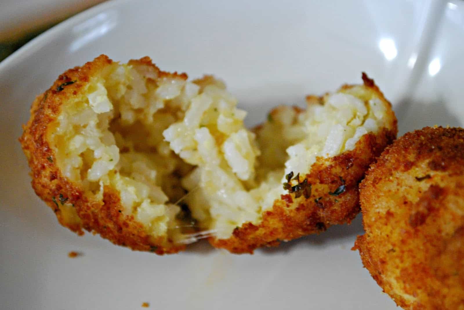 open arancini with cheese inside