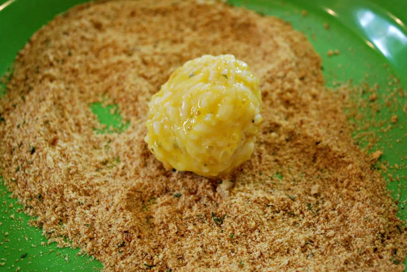 arancini dipped in egg and bread crumbs