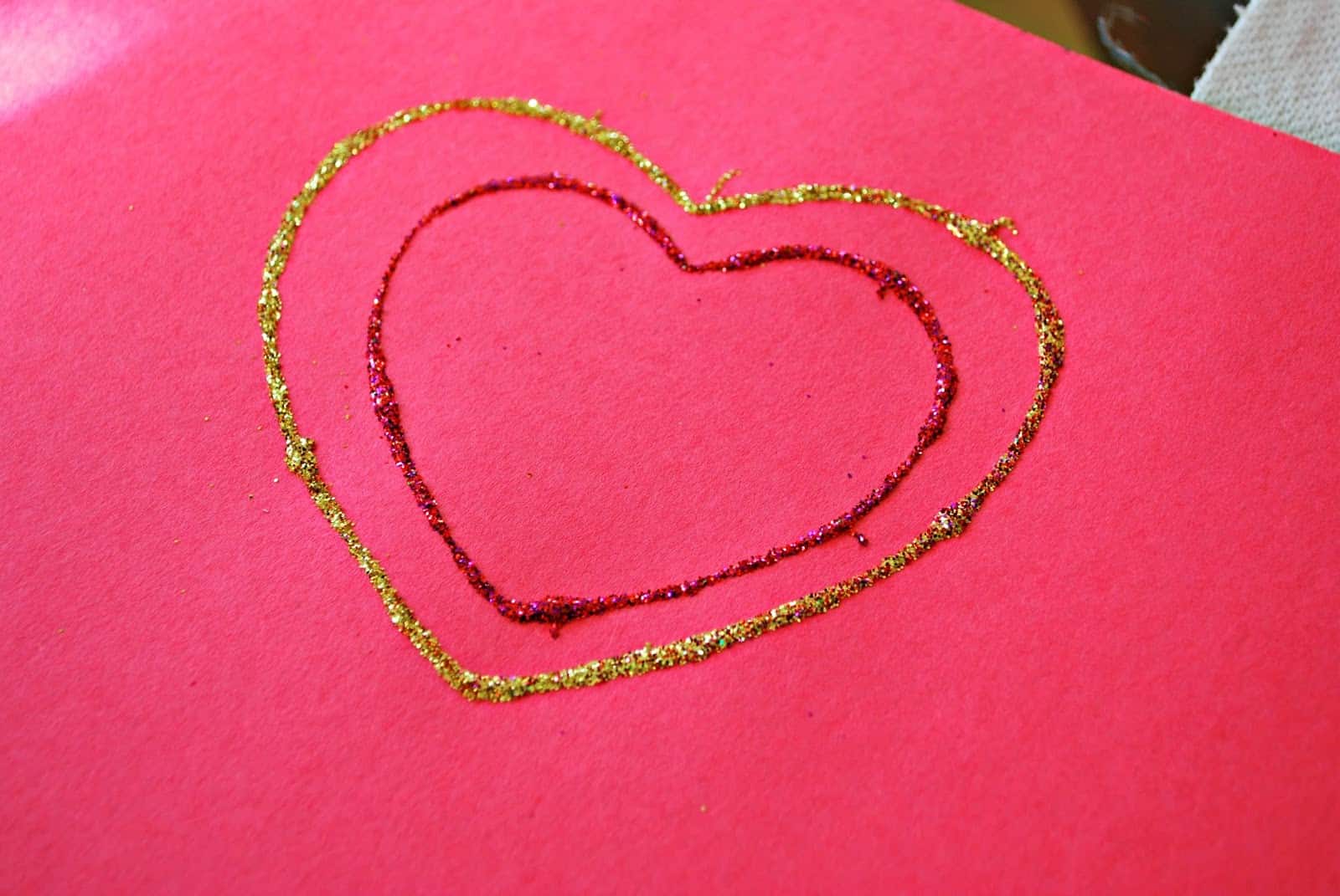 glitter hearts on red paper