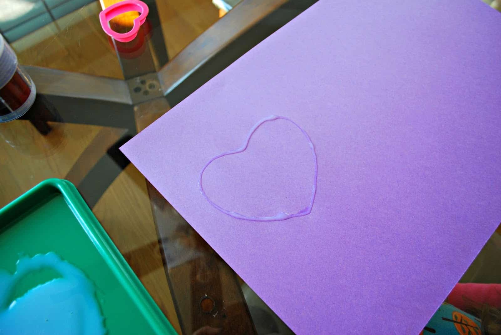 purple paper with a glue outline heart
