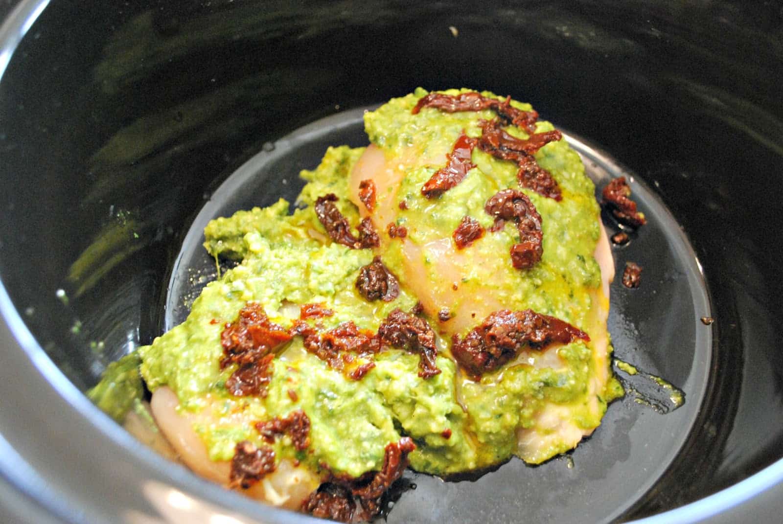 chicken pesto and sundried tomatoes in a crock pot