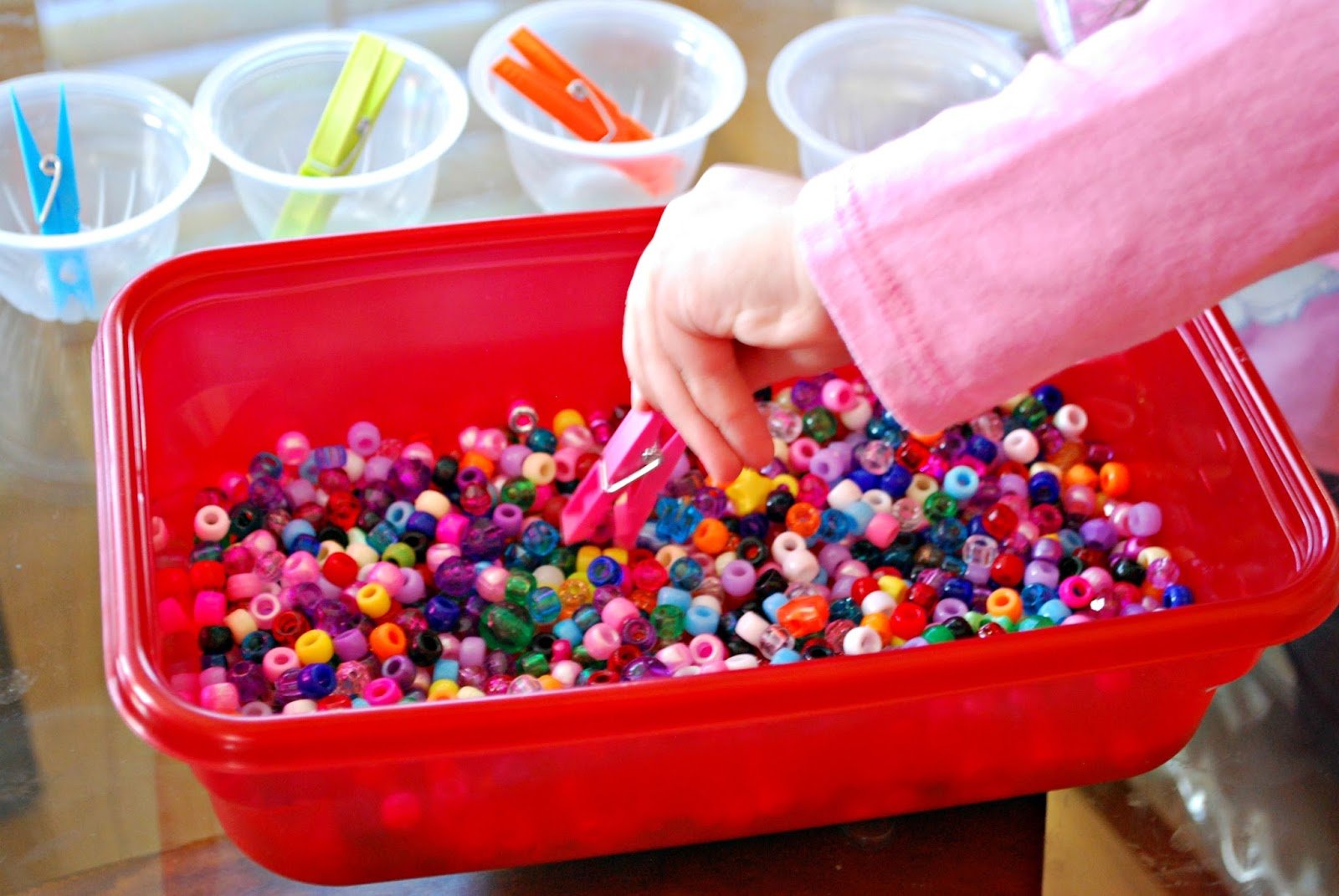 fine motor skills activity with beads