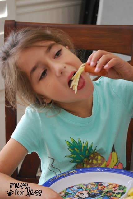 child eating spaghetti