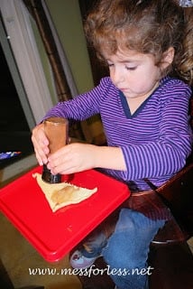 child making crescent rolls