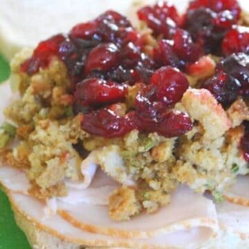 cropped turkey stuffing and cranberry sauce on a slice of bread