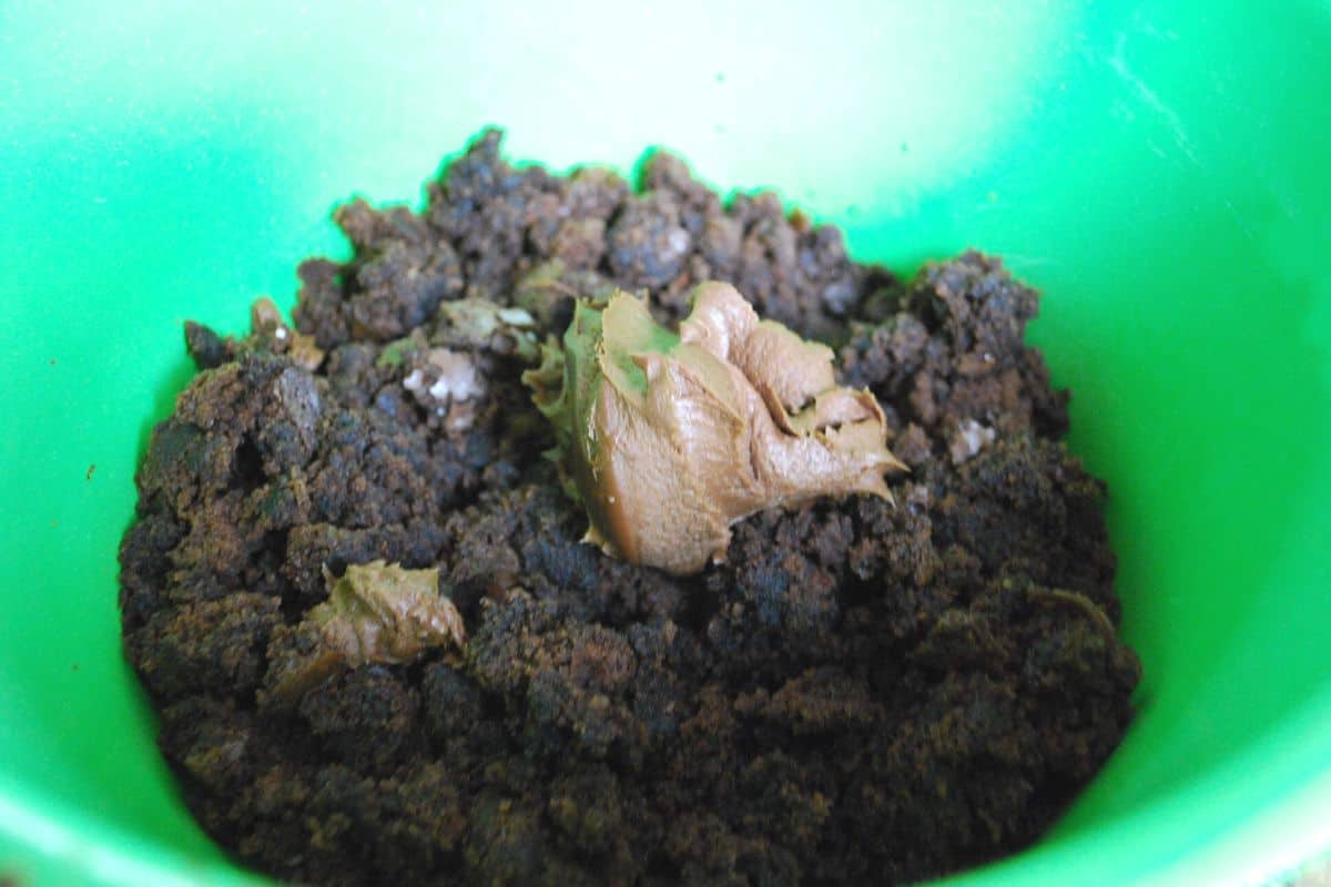 crumbled brownies and frosting in bowl