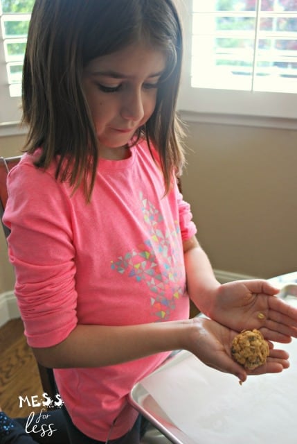 child making no bake energy bites