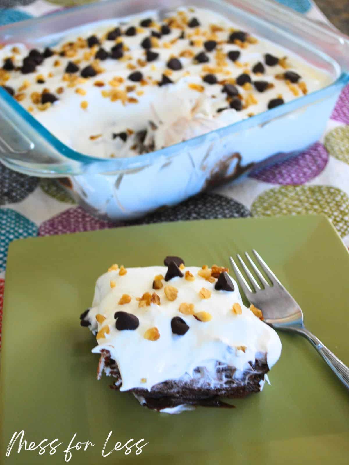 slice of no bake chocolate cake with cake pan in background