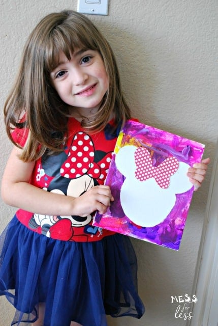 child sharing minnie mouse craft