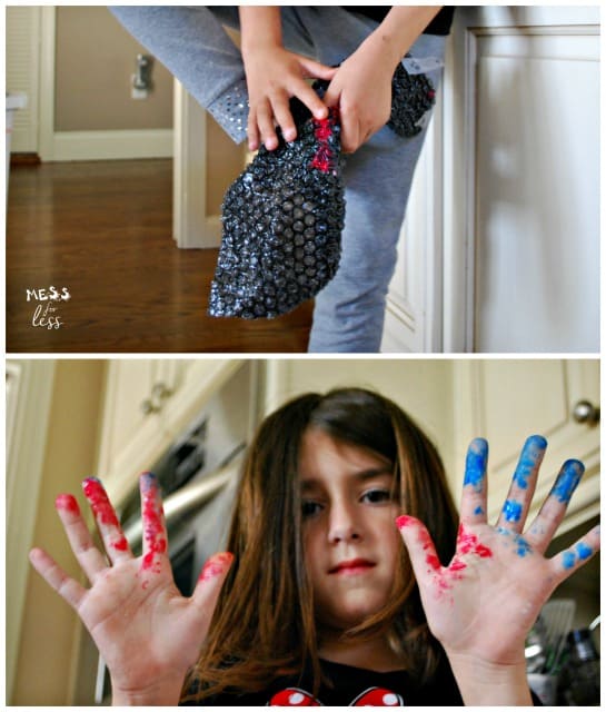 child with paint on hands