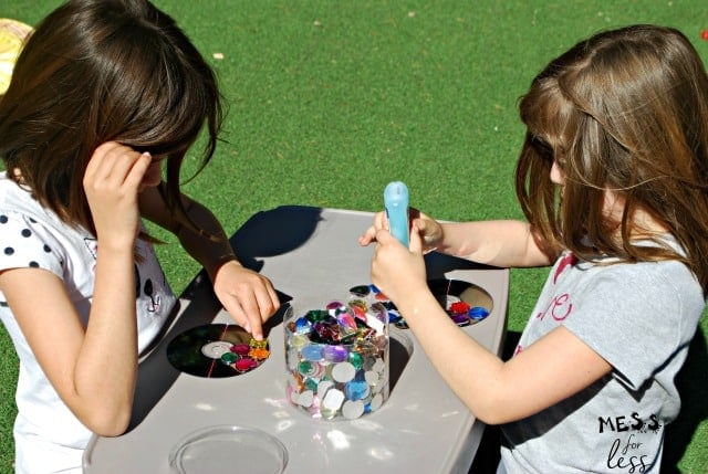 kids making a suncatcher craft