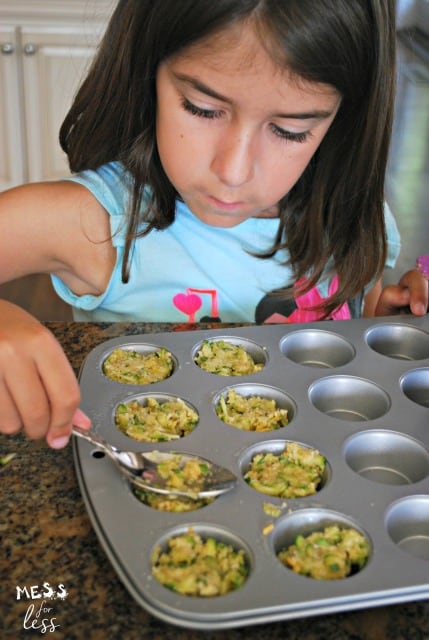 child making zucchini tots