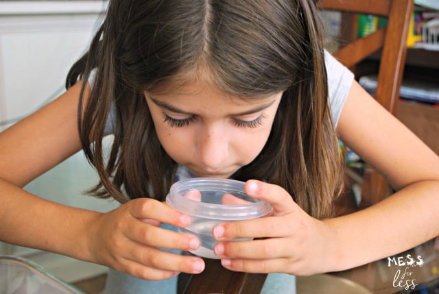 child smelling vinegar