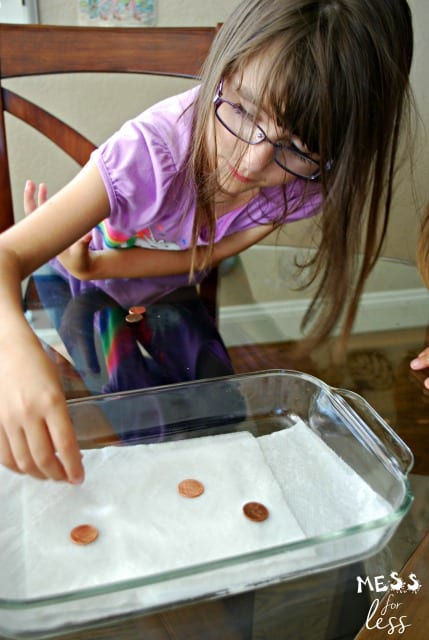 placing pennies on napkin