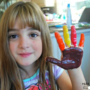 child with painted hand