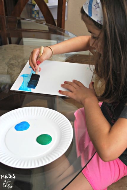 child painting canvas