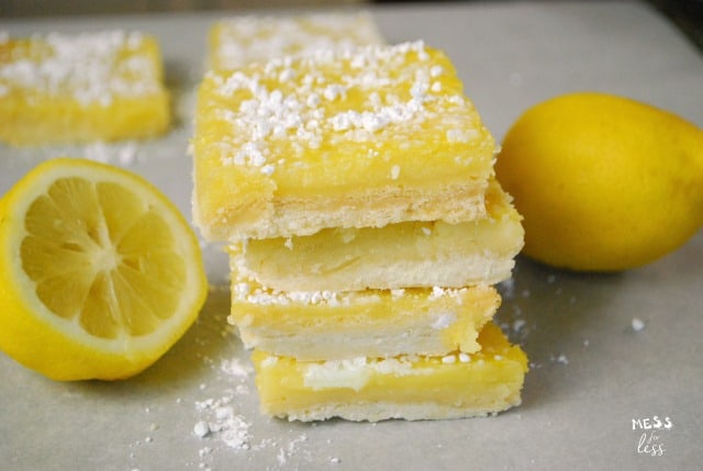stack of lemon bars and lemons