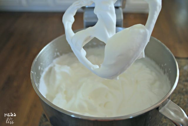  angel food cake batter being mixed in a stand mixer