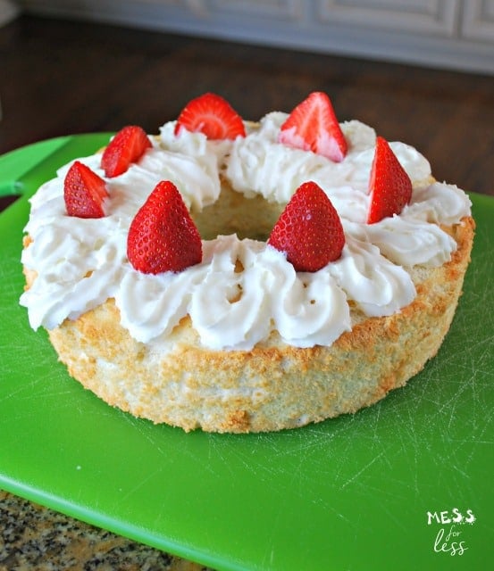 angel food cake with whipped cream and strawberries