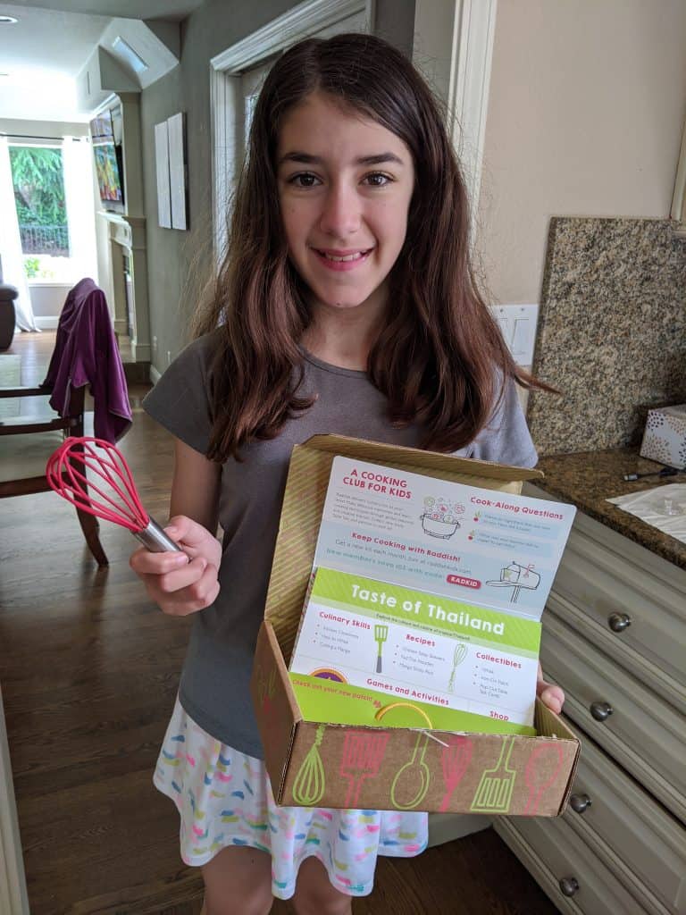 child holding a radish kids kit