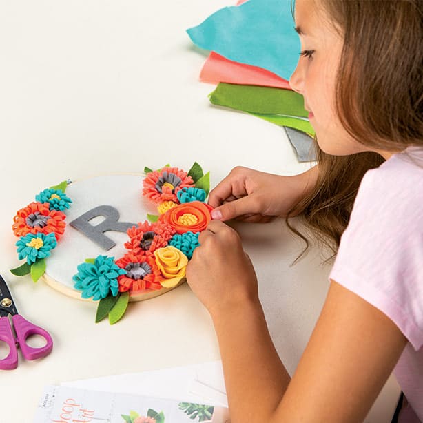 child making a flower craft