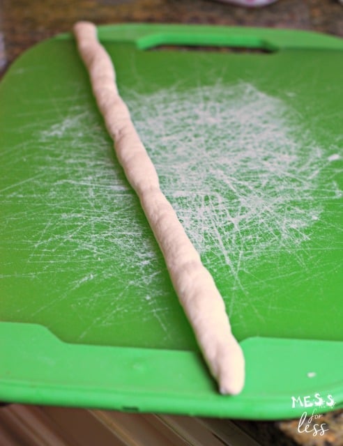 dough rope on green cutting boards