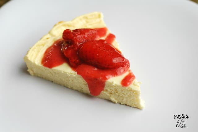 slice of one point cheesecake with strawberries