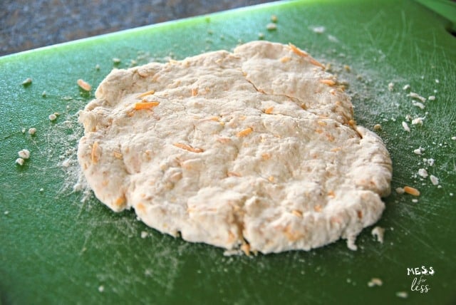 rolling out dough for Cheesy Biscuits with Two Ingredient Dough