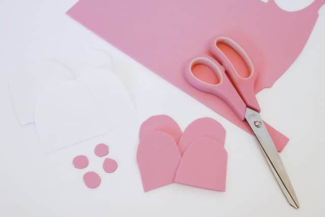 scissor and pink foam in various shapes