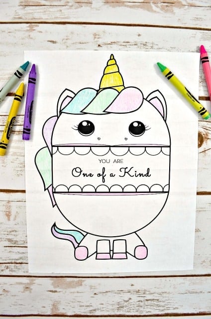 unicorn coloring sheet with message and crayons