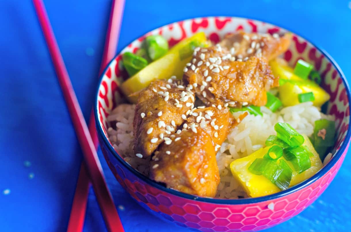 teriyaki pork in a bowl with chopsticks