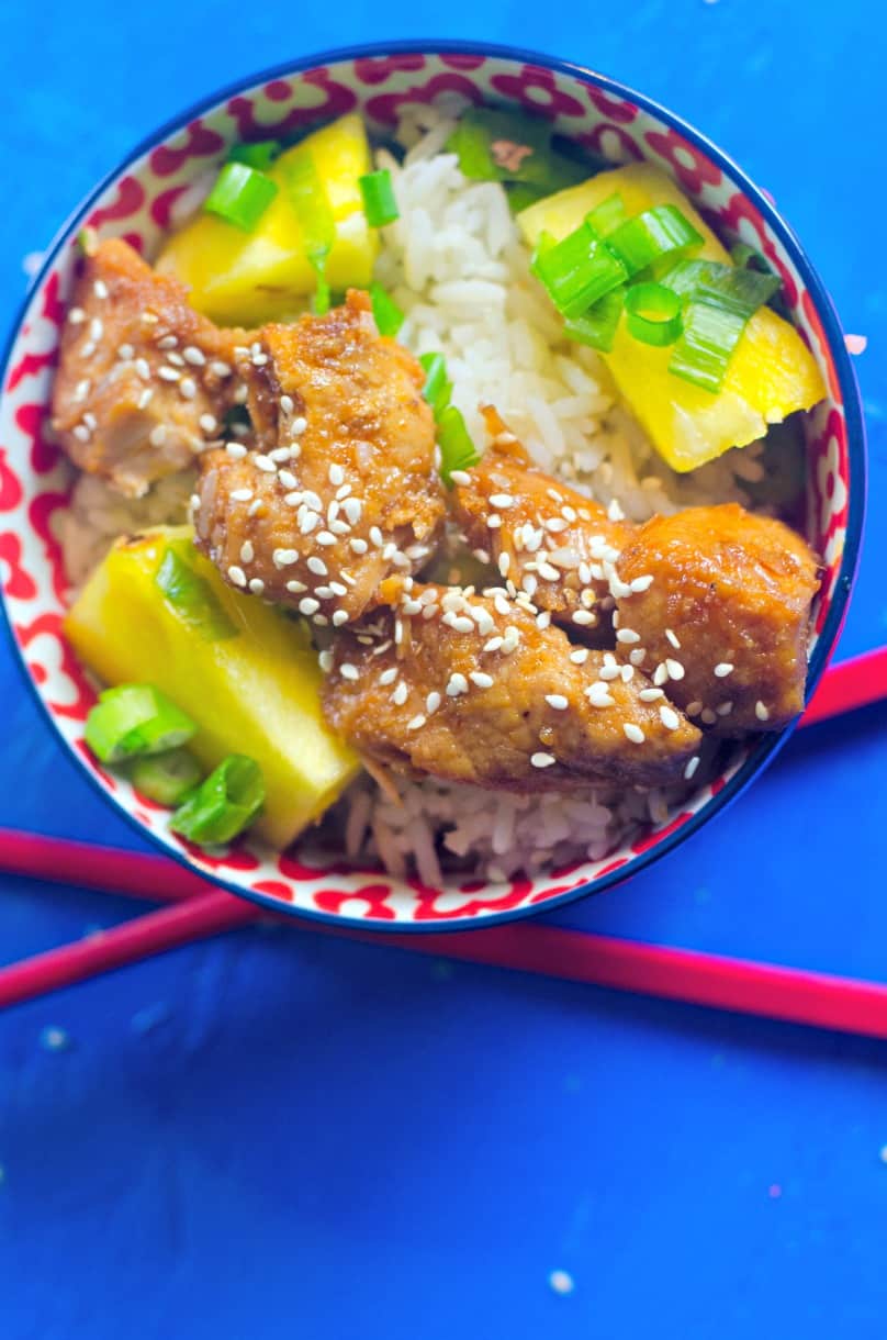 teriyaki pork in bowl with rice and pineapple
