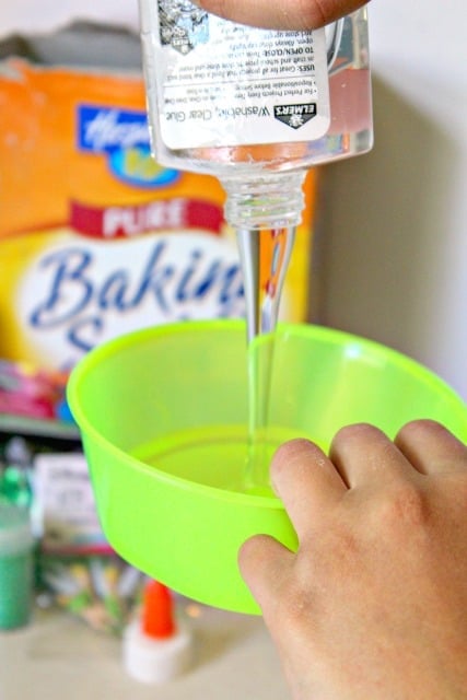 clear glue being poured into a bowl