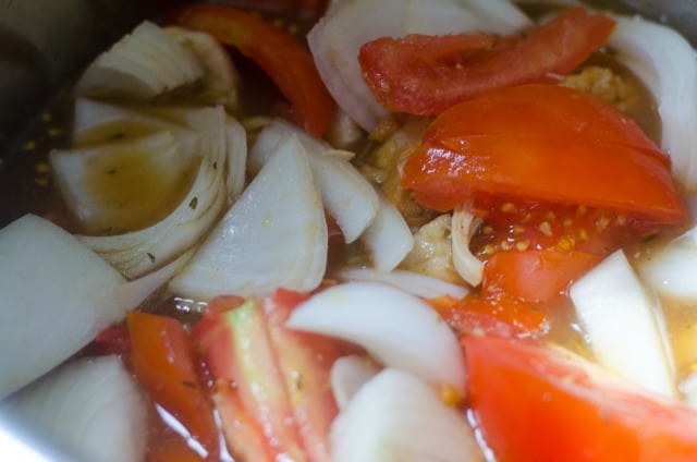 tomatoes and onions in a pressure cooker