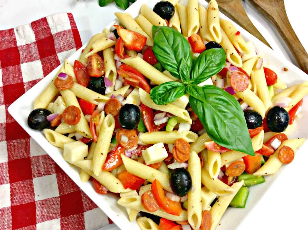 pasta salad with olives and cheese on a plate