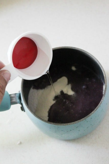 pouring water into a saucepan with gelatin powder