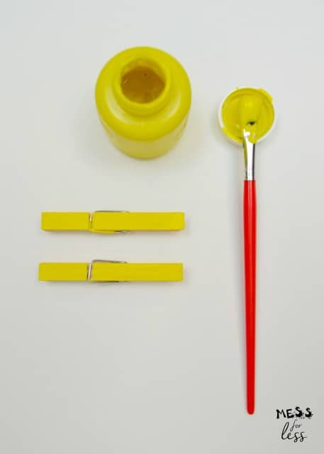 yellow paint and clothes pins
