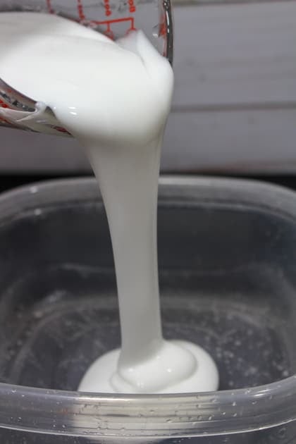 pouring glue into a bowl