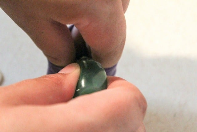 adding food coloring to a balloon