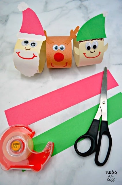 santa reindeer elf and paper and scissors