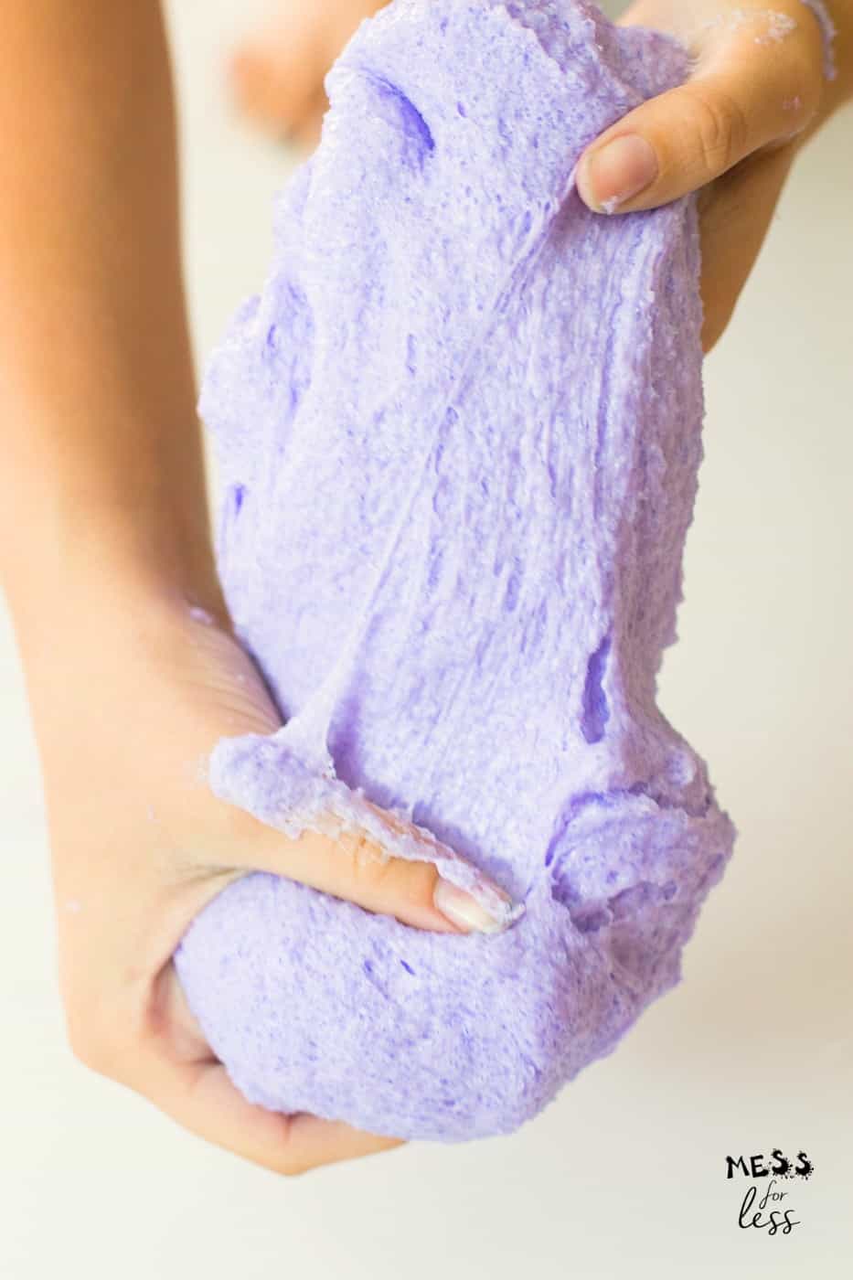 purple cloud slime being stretched by hands