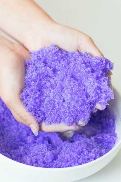 holding purple instant snow