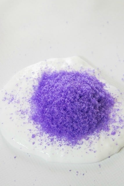 purple instant snow on top of white slime