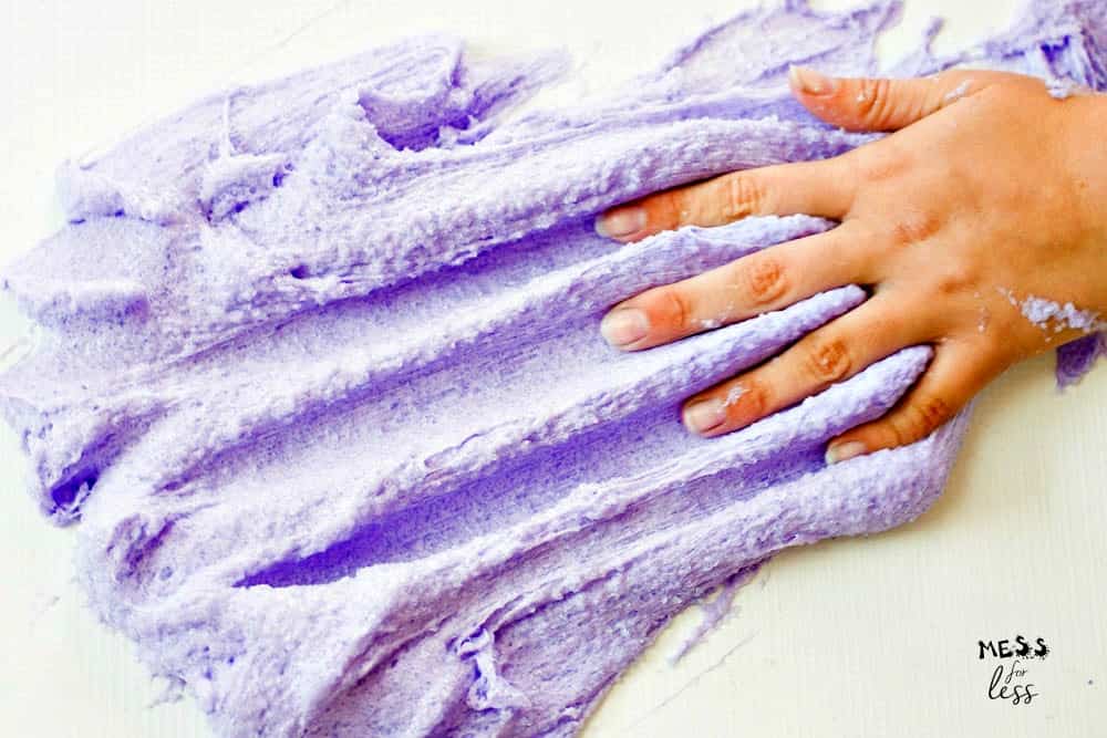 hand touching purple cloud slime