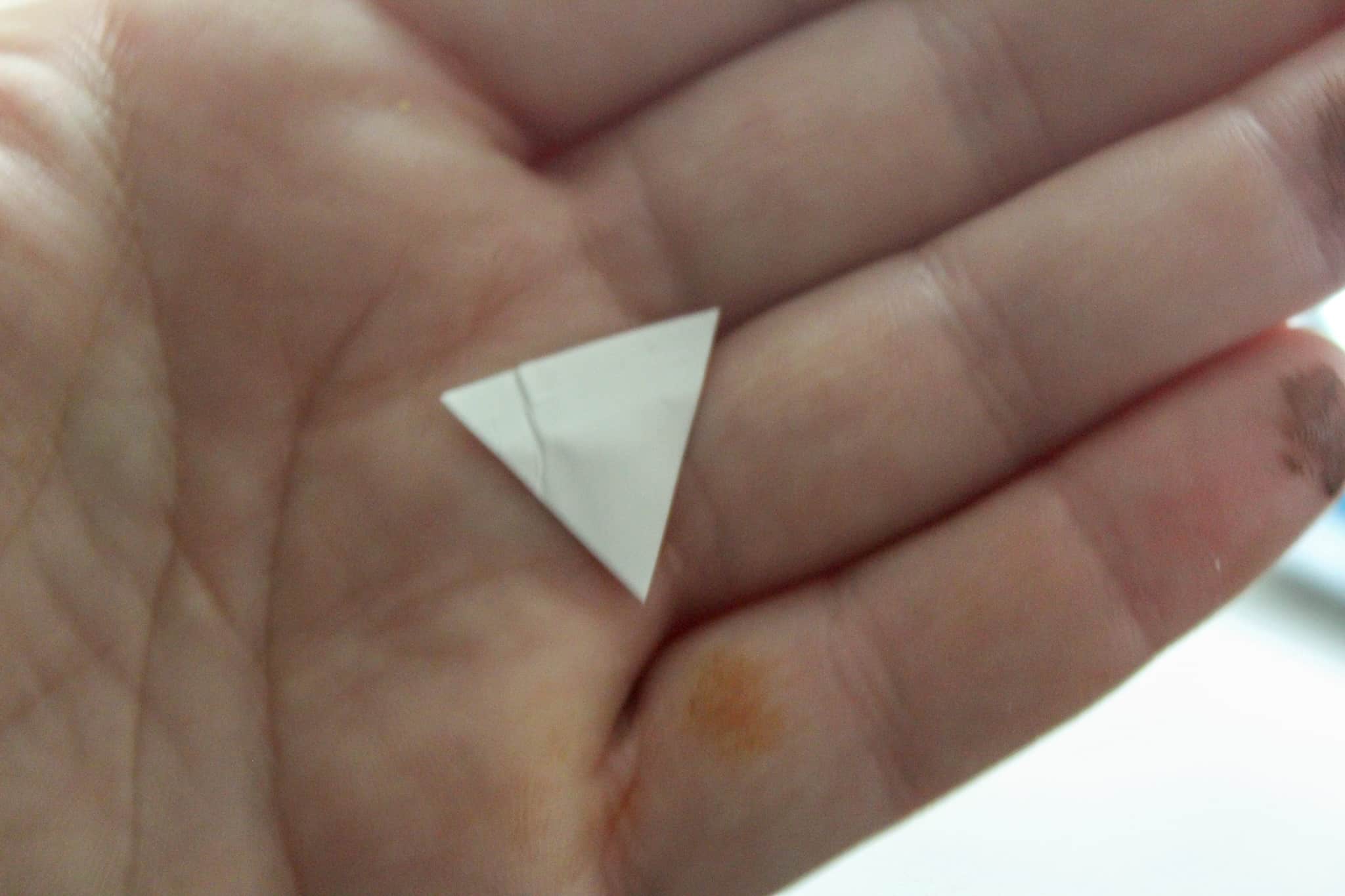 white triangle in hand