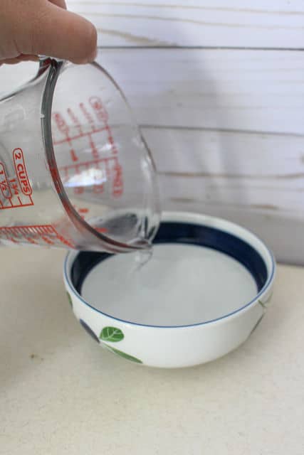pouring water into a bowl